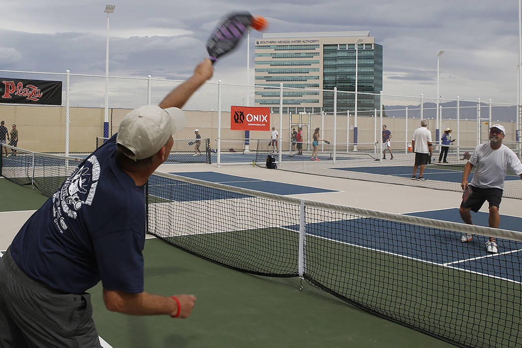 Joe Neeme, 69, from left, Scott Merritt, 59, and Mark Evans, 62, plays a match during the Sin City Showdown pickleball tournament at the Plaza Hotel on Friday, April 7, 2017, in downtown Las Vegas ...