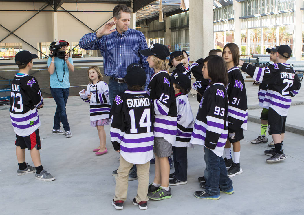 Senior Vice President for the Golden Knights Murray Craven gives participants with Nevada Storm youth hockey program a tour of the Golden Knights' practice facility construction site in Las Vegas  ...