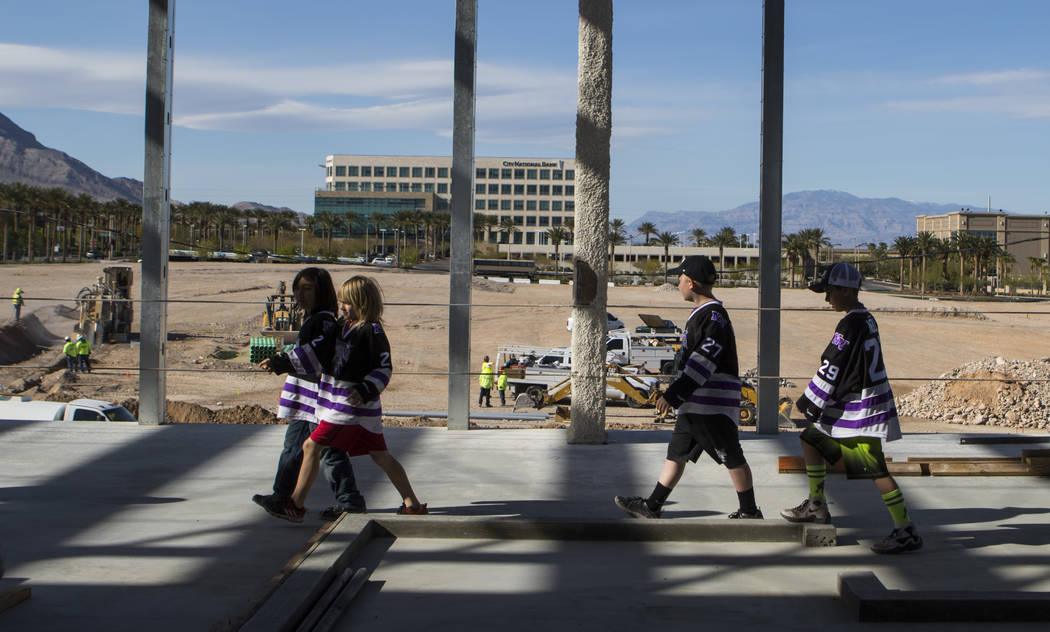 Senior Vice President for the Golden Knights Murray Craven, not pictured, gives participants with Nevada Storm youth hockey program a tour of the Golden Knights' practice facility construction sit ...