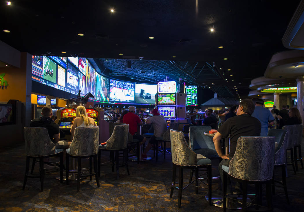 Fans take in the first day of the NCAA basketball tournament at the Westgate sports book in Las Vegas on March 16, 2017. (Chase Stevens/Las Vegas Review-Journal) @csstevensphoto
