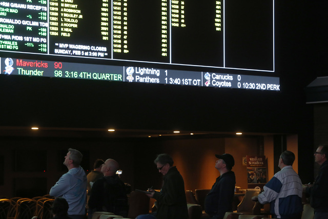 Bettors looks at a TV screen while standing in line to place their bets at the Westgate sports book on Thursday, Jan. 26, 2017, in Las Vegas. (Christian K. Lee/Las Vegas Review-Journal) @chrisklee ...