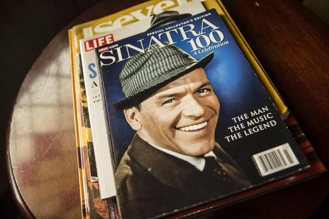 Photos, paintings and other memorabilia significant to Las Vegas, such as this Music Icons Magazine celebrating Frank Sinatra, decorate the walls at the Golden Steer Steakhouse on Wednesday, April ...
