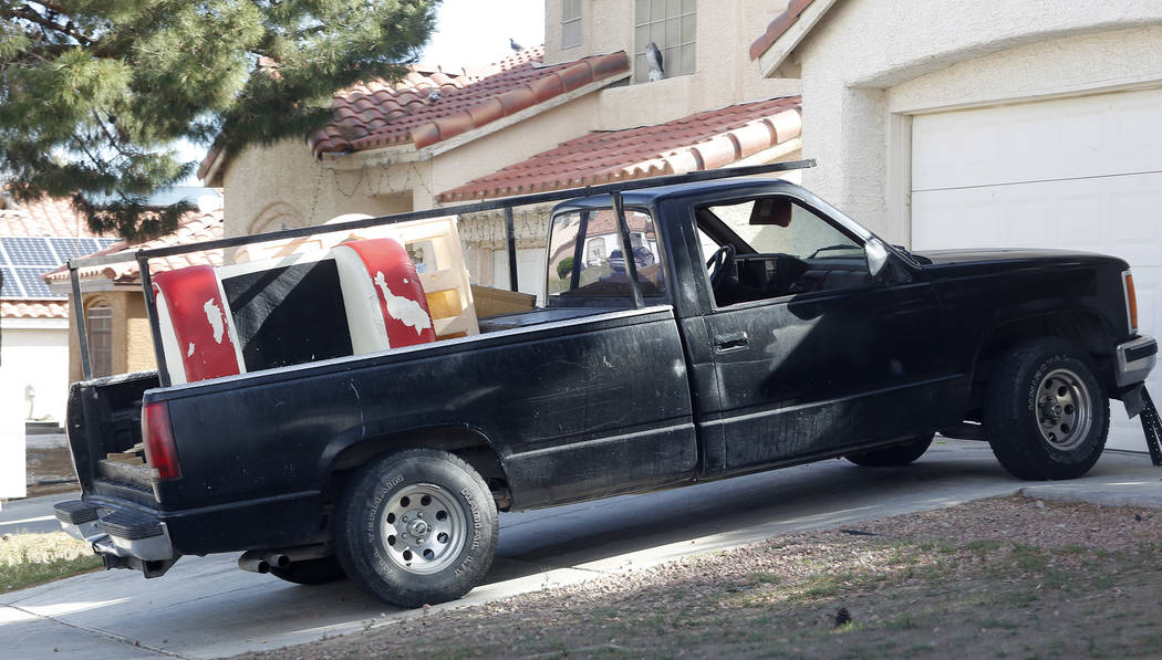 A car in front of an alleged squatter home on Wednesday, April 5, 2017, in North Las Vegas. Unlawful occupants of abandoned homes can easily turn on the power, water, gas and cable. Christian K. L ...
