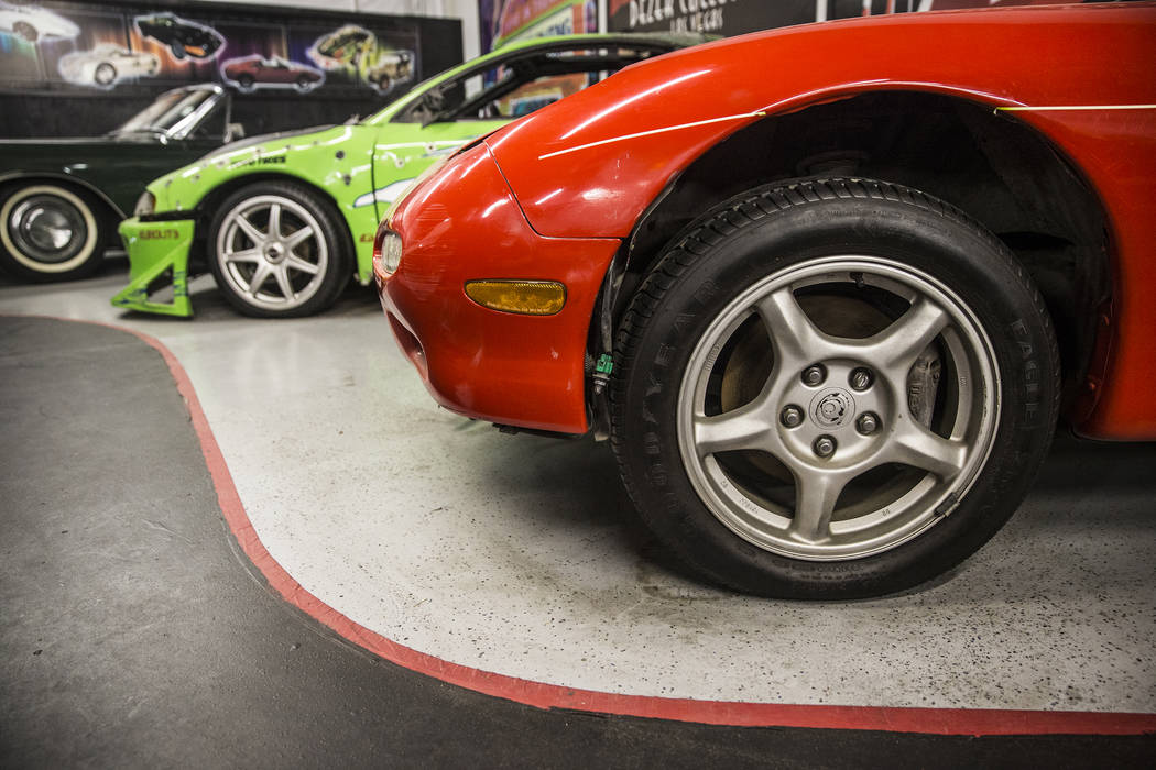The 1996 Mitsubishi Eclipse, left, and the 1993 Mazda RX-7 featured in the first of the Fast and the Furious movie series at the Hollywood Cars Museum on Tuesday, April, 4, 2017, at Hot Rod City, ...