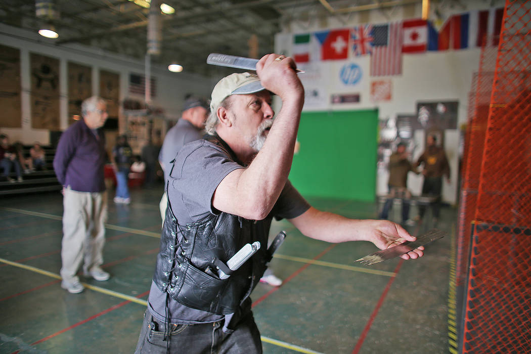 Bill Lagrosso practices speed throwing knives at the U.S. Nationals Pro/Am Knife & Tomahawk Championships on Sunday, April 9, 2017, at the Superhero Foundry in Las Vegas. The event is a fundra ...