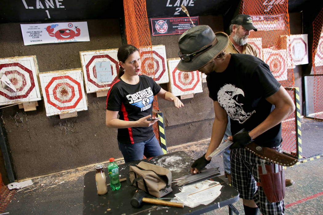 Melody Cuenca talks to Judah Myers before he competes at the U.S. Nationals Pro/Am Knife & Tomahawk Championships on Sunday, April 9, 2017, at the Superhero Foundry in Las Vegas. The event is  ...