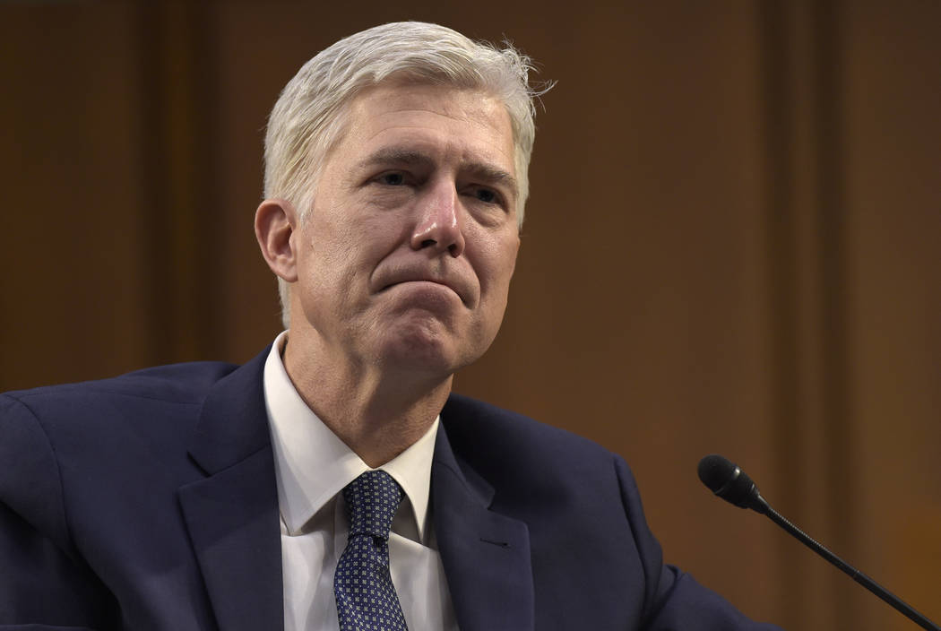 Supreme Court Justice nominee Neil Gorsuch listens as he is asked a question during his confirmation hearing before the Senate Judiciary Committee, March 22, 2017. (Susan Walsh/AP)