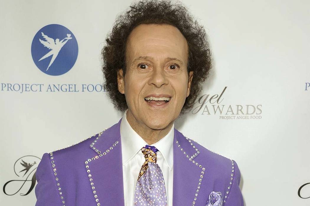 In this Aug. 10, 2013 file photo, fitness guru Richard Simmons arrives at the Project Angel Food's 2013 Angel Awards in Los Angeles. (Richard Shotwell/Invision/AP)