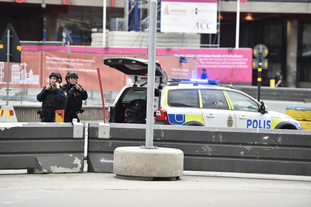 Police attend  the scene after a truck crashed into a department store injuring several people in central Stockholm, Sweden, Friday April 7, 2017. (Noella Johansson/TT News Agency via AP)