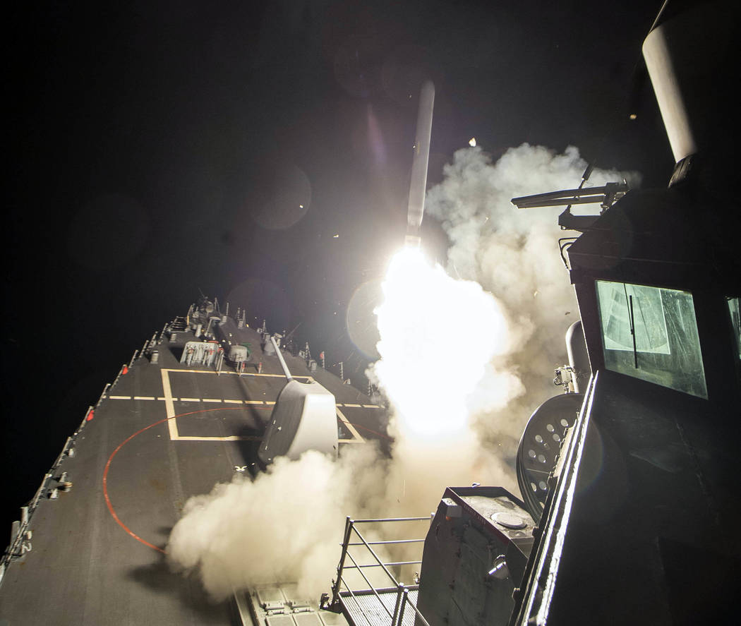 The USS Ross (DDG 71) fires a tomahawk land attack missile Friday, April 7, 2017, from the Mediterranean Sea. (Mass Communication Specialist 3rd Class Robert S. Price/U.S. Navy via AP)
