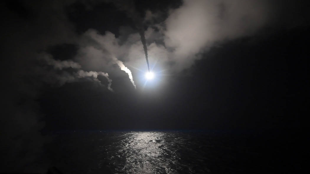 The guided-missile destroyer USS Porter (DDG 78) launches a tomahawk land attack missile in the Mediterranean Sea, Friday, April 7, 2017. (Mass Communication Specialist 3rd Class Ford Williams/U.S ...