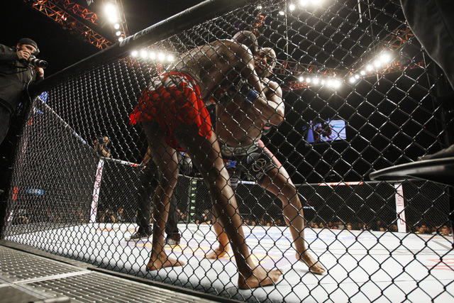 Jon Jones, left, and Daniel Cormier grapple during their fight at UFC 182 Saturday, Jan. 3, 2015 at the MGM Grand Garden Arena. Jones won a unanimous decision. (Sam Morris/Las Vegas Review-Journal)