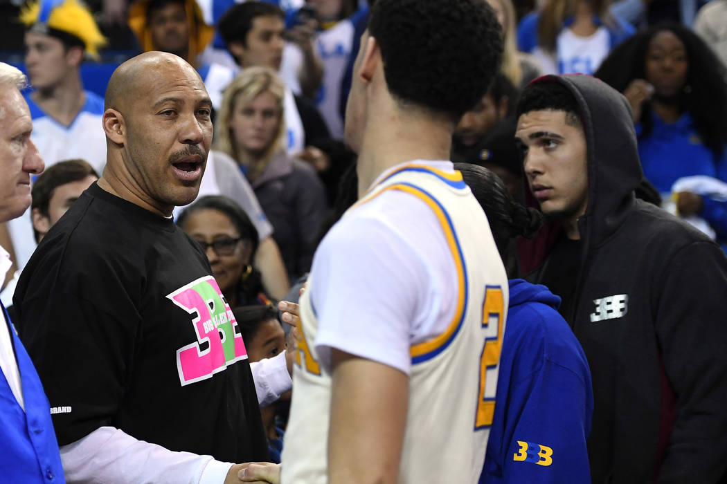 In this March 4, 2017, file photo, UCLA guard Lonzo Ball, right, shakes hands with his father LaVar following an NCAA college basketball game against Washington State in Los Angeles. UCLA won 77-6 ...