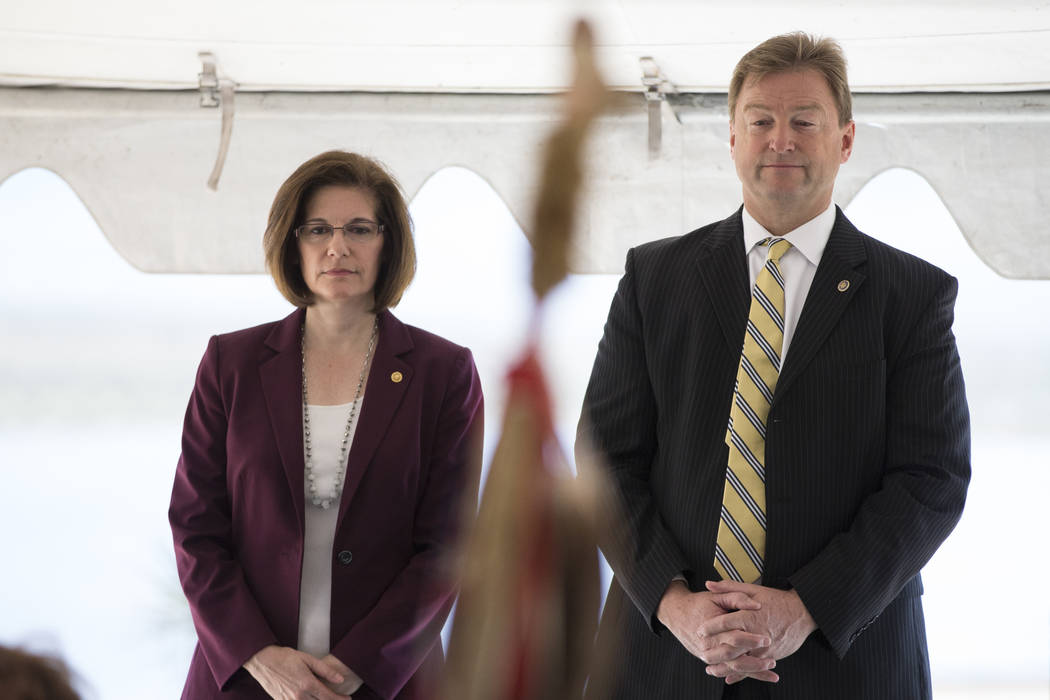 U.S. Sen. Catherine Cortez Masto, D-Nev., left, and U.S. Sen. Dean Heller, R-Nev., attend the commissioning and blessing ceremony for the Moapa Southern Paiute Solar Project at the Moapa Indian Re ...