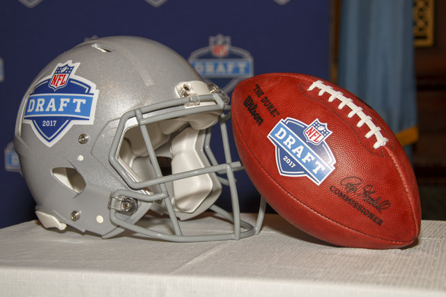 The 2017 NFL Draft helmet and football are shown on display during the press conference announcing that the 2017 NFL Draft will be held in Philadelphia, Thursday, Sept. 1, 2016, in Philadelphia. ( ...