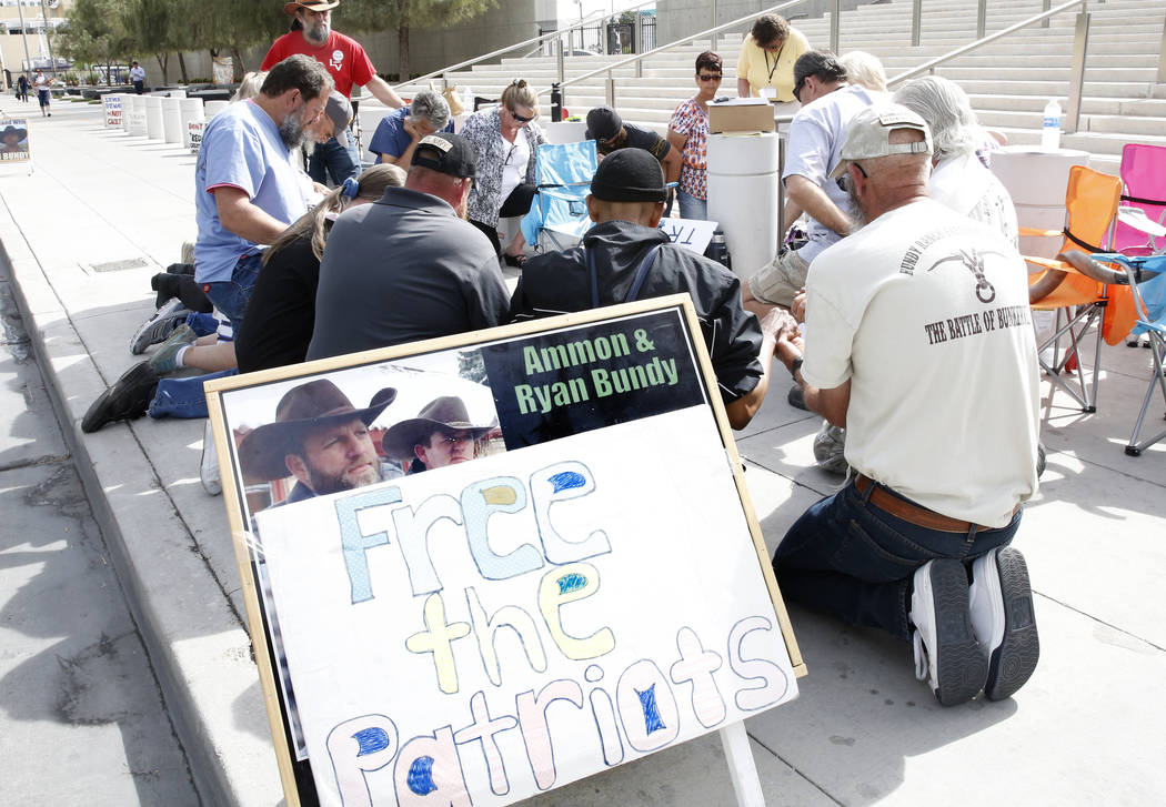 Supporters pray outside Lloyd George U.S. Courthouse as they await the jury's verdict in the first Bunkerville standoff trial on Monday, April 24, 2017, in Las Vegas. Bizuayehu Tesfaye Las Vegas R ...