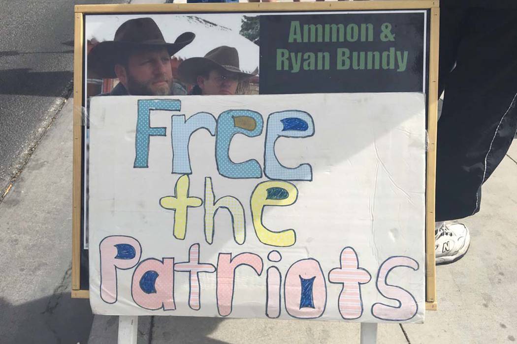 A protestor's sign outside the Lloyd George U.S. Courthouse as a jury has reached a verdict in the first trial of men charged in the 2014 armed standoff in Bunkerville, Monday, April 24, 2017. Biz ...