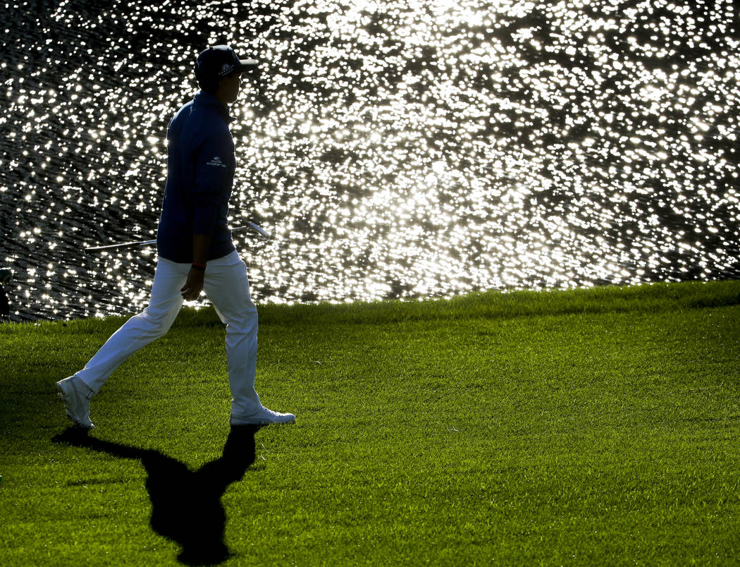 Rickie Fowler walks up the 16th fairway during the second round of the Masters golf tournament Friday, April 7, 2017, in Augusta, Ga. (Charlie Riedel/AP)