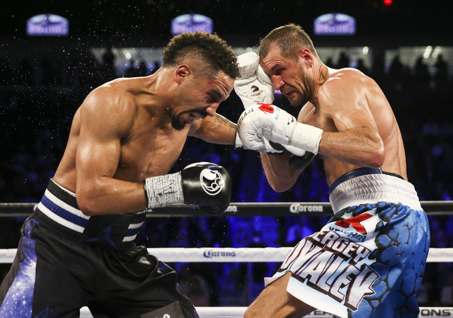 Andre Ward, left, and Sergey Kovalev trade punches during their light heavyweight title boxing match at T-Mobile Arena in Las Vegas on Saturday, Nov. 19, 2016. Ward won in a unanimous decision. Ch ...