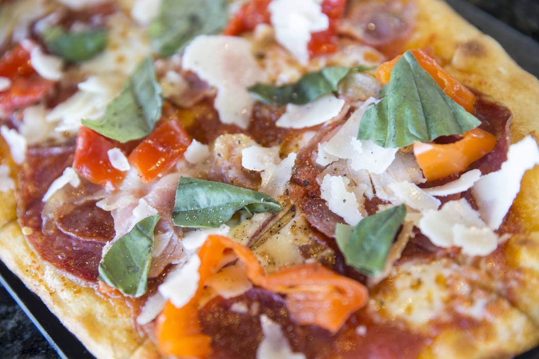 Salumi flatbread with pepperoni, porchetta, soppressata, mozzarella, parmesan and pickled peppers at Topgolf Las Vegas on Monday, April 10, 2017, at the MGM Grand hotel/casino, in Las Vegas. Benja ...