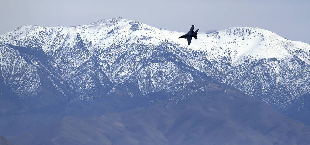 In this Feb. 27, 2017, photo, an F/A-18E Super Hornet from VFA-24 squadron at NAS Lemoore banks in front of the Panamint range while exiting the nicknamed Star Wars Canyon on the Jedi transition o ...
