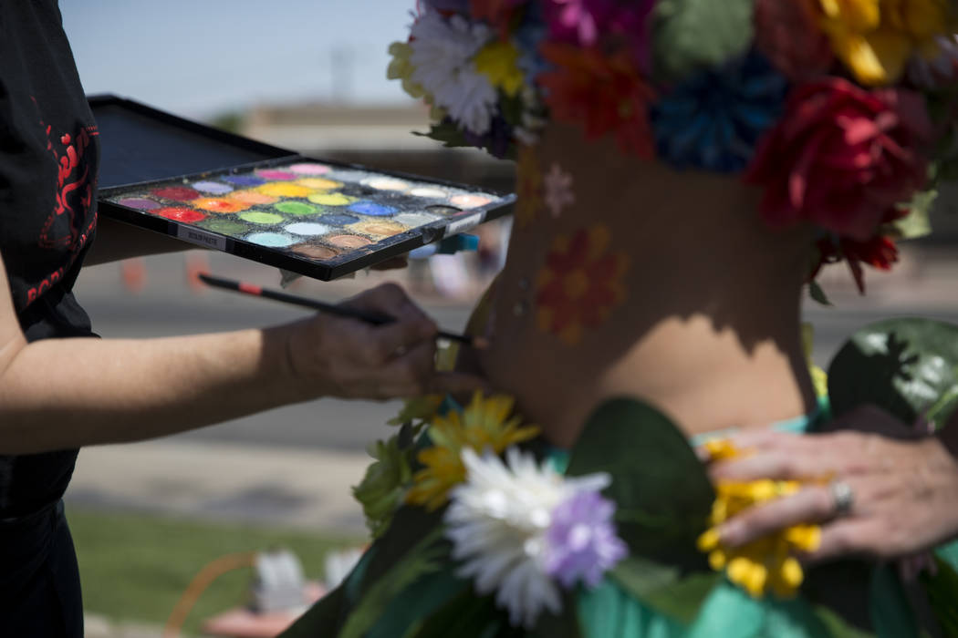 Artist Robin Slonina, left, paints Alissa Banks during the annual Henderson Heritage Parade and Festival on Saturday, April 15, 2017, in Henderson. Erik Verduzco Las Vegas Review-Journal @Erik_Ver ...