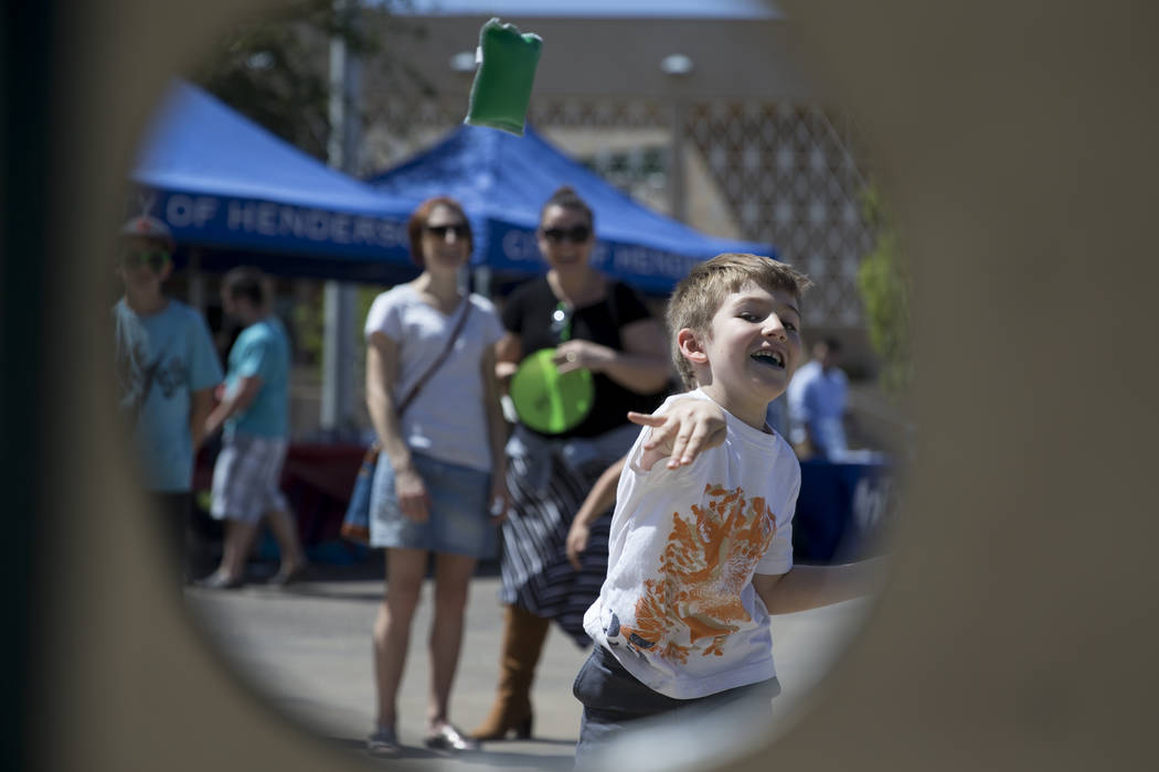 Alex Marudas, 5, tosses a bean bag during the annual Henderson Heritage Parade and Festival on Saturday, April 15, 2017, in Henderson. Erik Verduzco Las Vegas Review-Journal @Erik_Verduzco