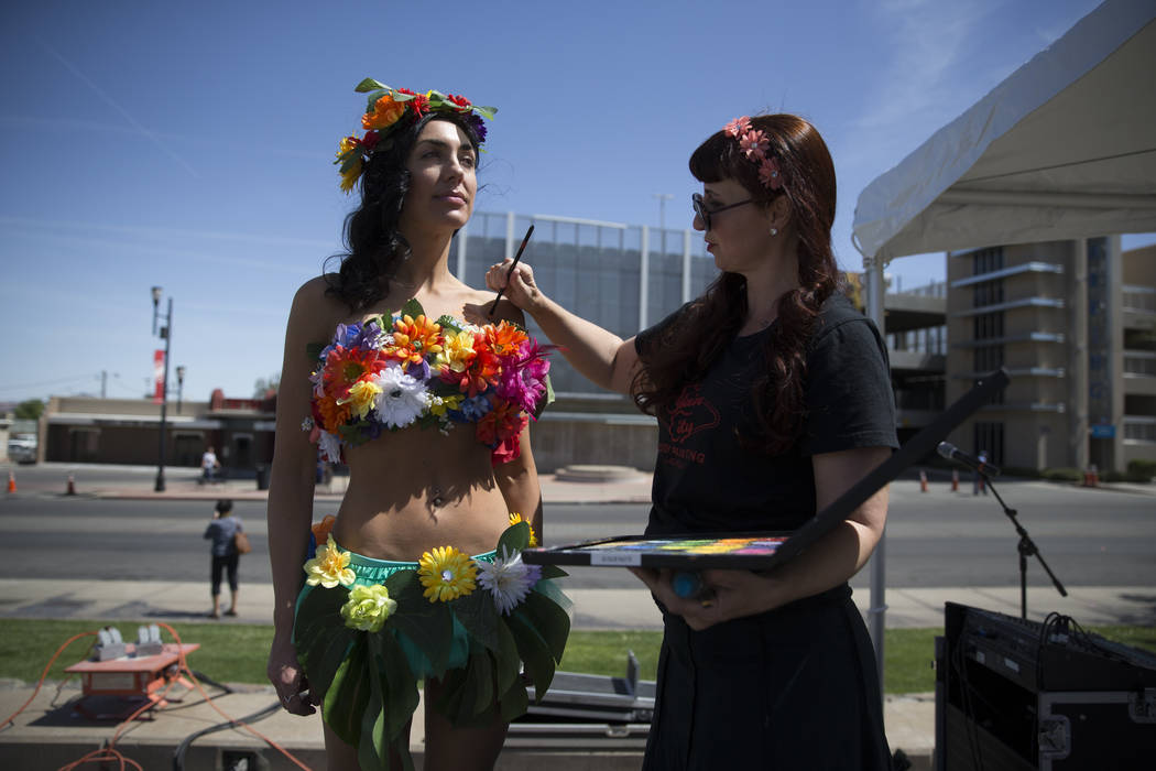 Artist Robin Slonina, right, paints Alissa Banks during the annual Henderson Heritage Parade and Festival on Saturday, April 15, 2017, in Henderson. Erik Verduzco Las Vegas Review-Journal @Erik_Ve ...