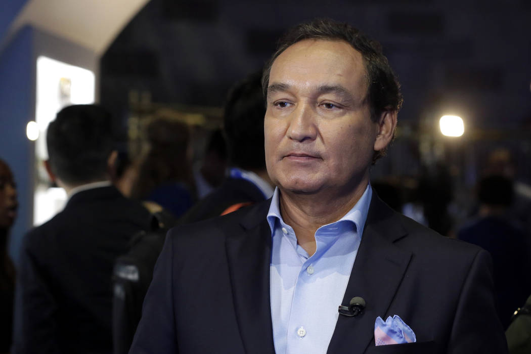 In this June 2, 2016, photo, United Airlines CEO Oscar Munoz waits to be interviewed. On Wednesday, Munoz said he was committed to “fix what’s broken so this never happens again.” (AP Photo/ ...