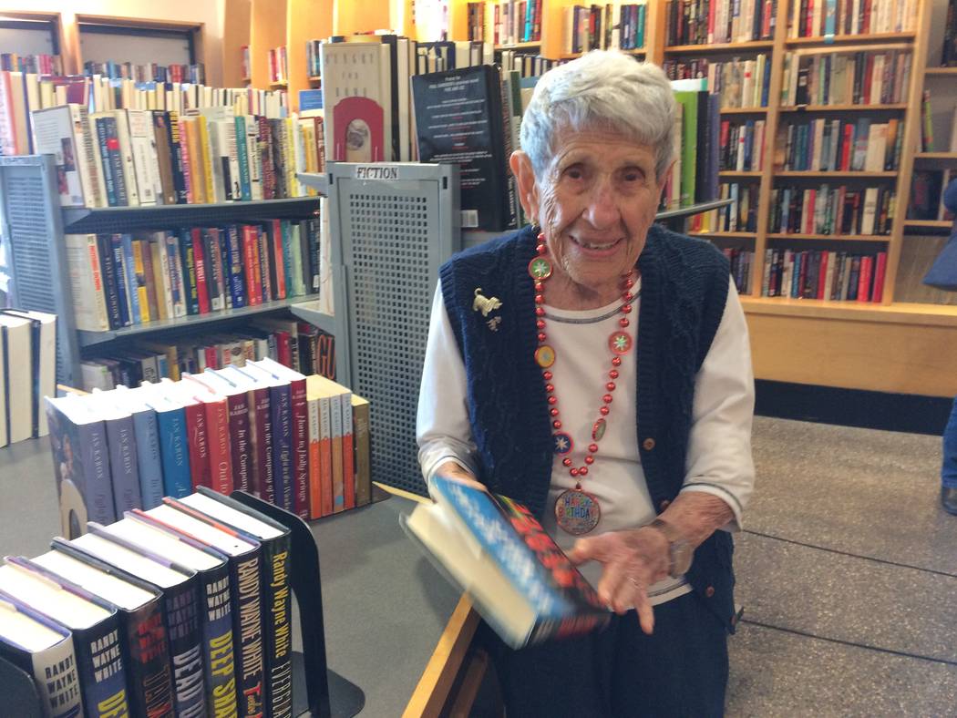 Gladys Stroud looks over a book March 24, 2017, at the used book store inside Sahara West Library, 9600 W. Sahara Ave. She’s been volunteering there for the past 13 years and recently turned 100 ...
