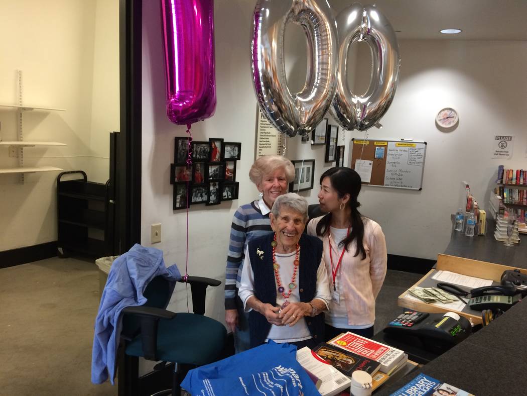 Gladys Stroud pauses March 24, 2017, with fellow bookstore workers Fran Clagett and Amike Tange. The balloons overhead mark Stroud’s 100th birthday. When she lived in California, she took a part ...