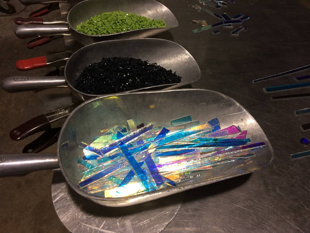 Colored piece of glass were laid out, ready to be used to add interest to hot glass pieces April 7, 2017,  at Domsky Glass, 2758 S. Highland Drive. The studio is opening up one weekend a month to  ...
