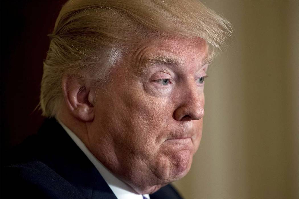 President Donald Trump pauses during a news conference with NATO Secretary General Jens Stoltenberg in the East Room at the White House in Washington, Wednesday, April 12, 2017, in Washington. (An ...