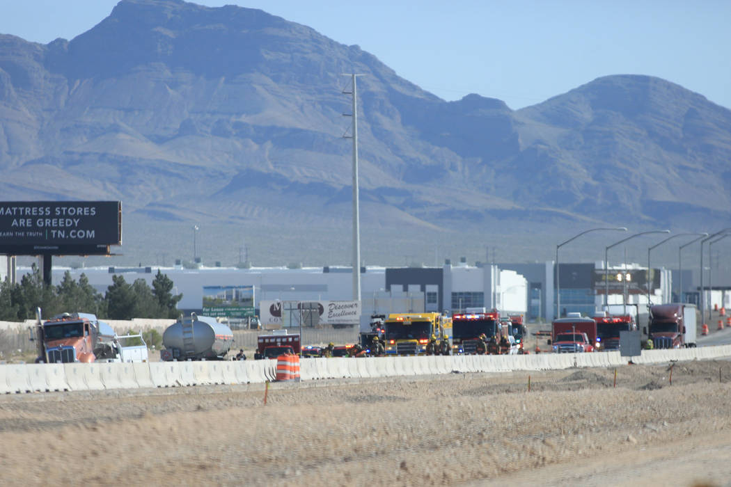 Las Vegas and Clark County firefighters work to clean a spill that has shutdown all southbound lanes on I-15 near Lamb Boulevard on Thursday, April 13, 2017. Brett Le Blanc Las Vegas Review-Journa ...