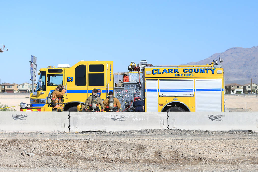 Clark County firefighters work to clean a spill that has shutdown all southbound lanes on I-15 near Lamb Boulevard on Thursday, April 13, 2017. Brett Le Blanc Las Vegas Review-Journal @bleblancphoto