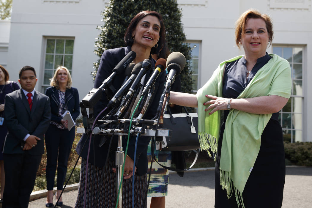 Marjorie Dannenfelser, president of the Susan B. Anthony List, right, listens as Seema Verma, administrator of the Centers for Medicare and Medicaid Services, speaks with reporters outside the Whi ...