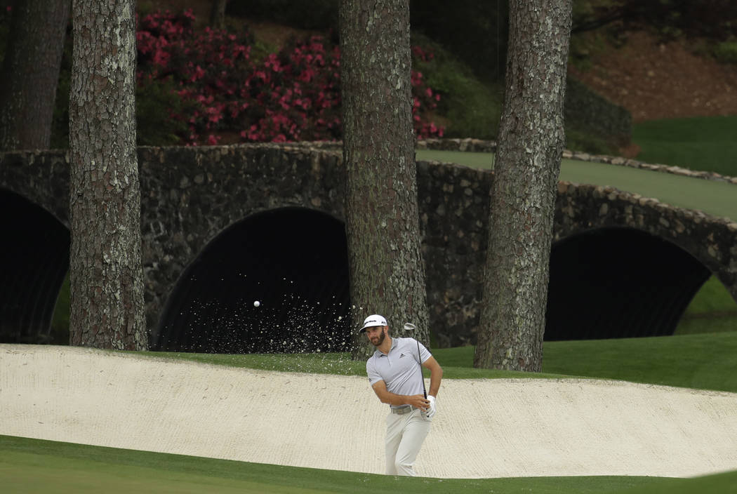 Dustin Johnson hits to the 11th hole during a practice round for the Masters golf tournament Wednesday, April 5, 2017, in Augusta, Ga. (Charlie Riedel/AP)