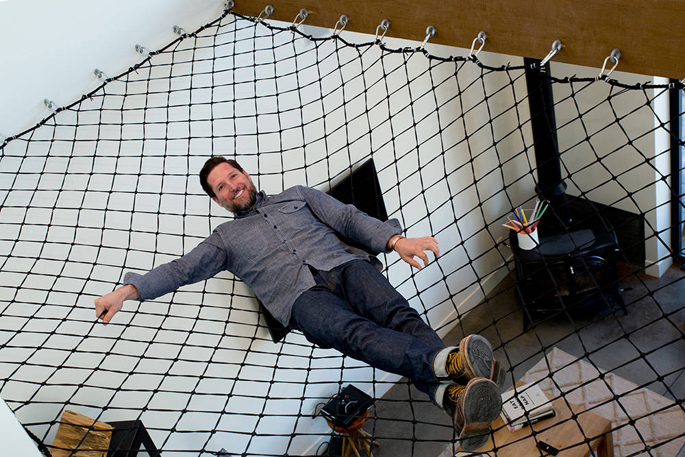 Guy Pinjuv had riggers that work on Strip shows install a hammock that is capable of holding 5,000 pounds. It hangs over a corner of his living room. (Tonya Harvey)