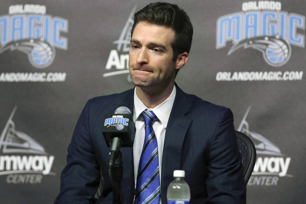 In this Feb. 5, 2015, file photo, Orlando Magic general manager Rob Hennigan pauses to answer a question during a news conference in Orlando, Fla. The Orlando Magic have fired general manager Rob ...