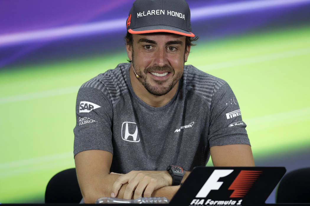 McLaren driver Fernando Alonso of Spain speaks to reporters during a news conference ahead the Bahrain Formula One Grand Prix at the Formula One Bahrain International Circuit in Sakhir, Bahrain, T ...