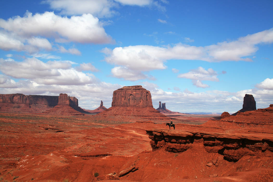 A Navajo man on horseback takes in the views at Monument Valley Navajo Tribal Park. (Deborah Wall)