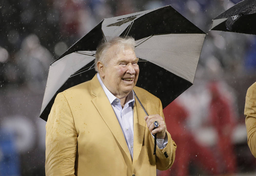 Former Oakland Raiders head coach John Madden smiles during a ceremony honoring former punter Ray Guy's induction into the pro football Hall of Fame during halftime of an NFL football game between ...