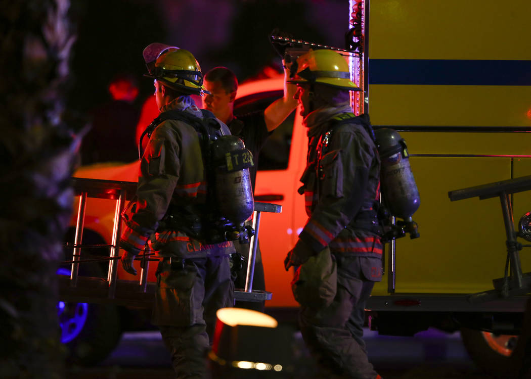 The Clark County Fire Department and other emergency personnel respond to the scene after part of the roof of the Bellagio hotel-casino caught fire in Las Vegas on Thursday, April 13, 2017. Chase  ...