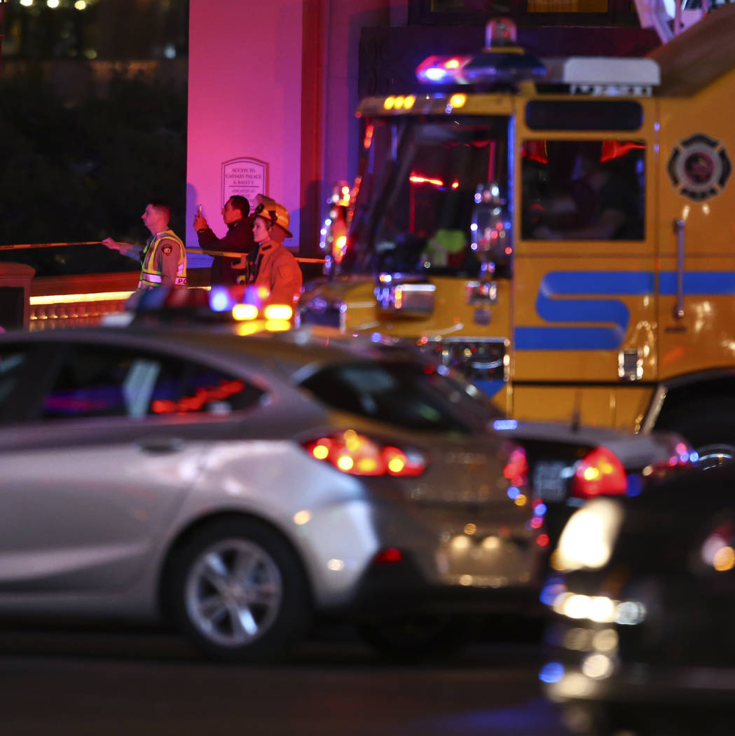 The Clark County Fire Department and other emergency personnel respond to the scene after part of the roof of the Bellagio hotel-casino caught fire in Las Vegas on Friday, April 14, 2017. Chase St ...