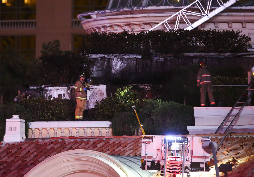 The Clark County Fire Department and other emergency personnel respond to the scene after part of the roof of the Bellagio hotel-casino caught fire in Las Vegas on Friday, April 14, 2017. Chase St ...