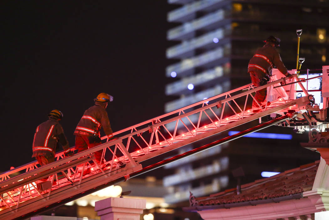 The Clark County Fire Department and other emergency personnel respond to the scene after part of the roof of the Bellagio hotel-casino caught fire in Las Vegas on Friday, April 14, 2017. Chase St ...