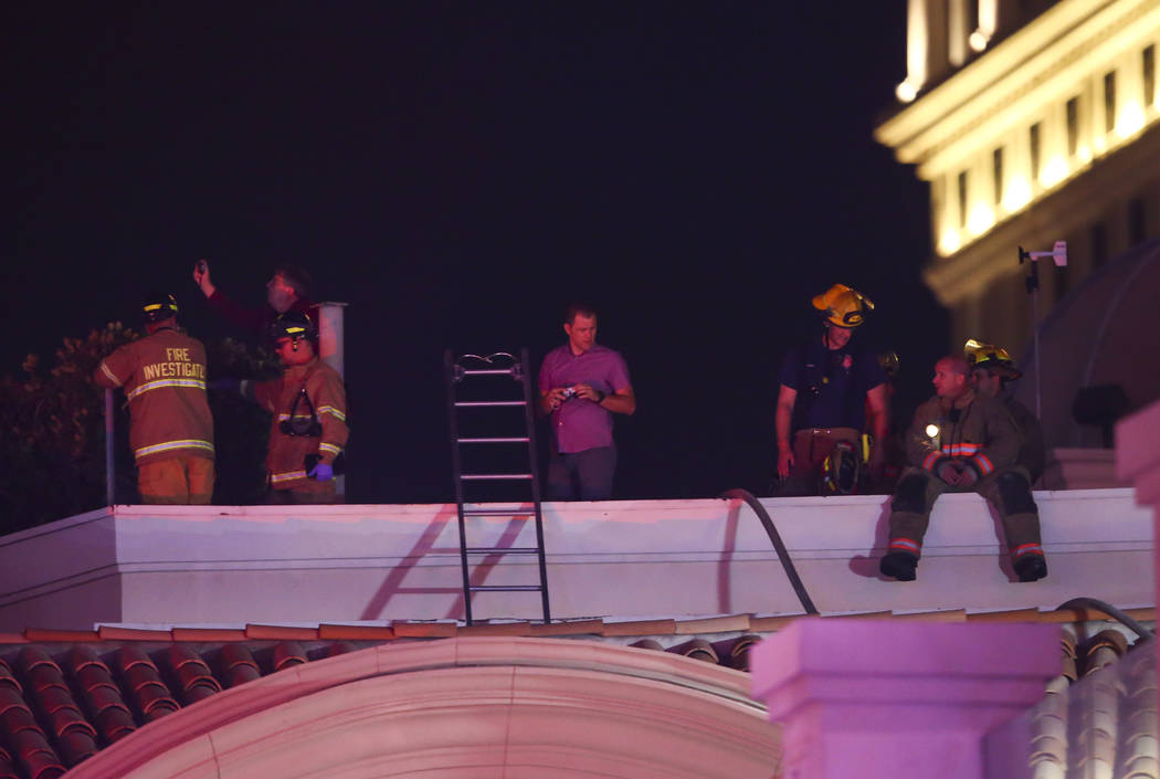 The Clark County Fire Department and other emergency personnel respond to the scene after part of the roof of the Bellagio hotel-casino caught fire in Las Vegas on Friday, April 14, 2017. Chase St ...