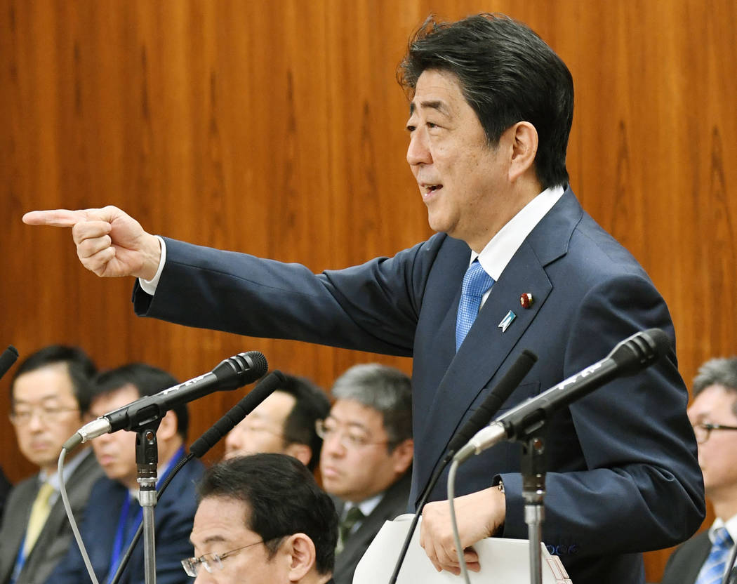 Japanese Prime Minister Shinzo Abe gestures while speaking at a parliamentary panel on national security and diplomacy at parliament's upper house in Tokyo Thursday, April 13, 2017. Abe warned tha ...