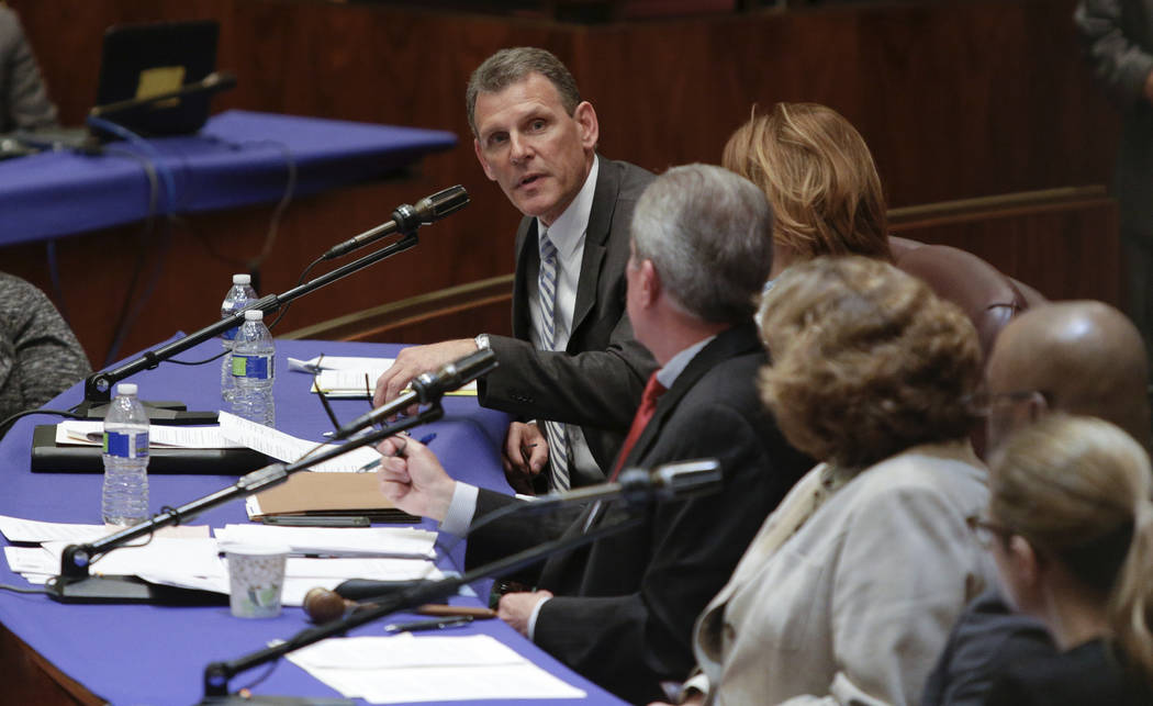John Slater, a United Airlines vice president, testifies at a City Council committee hearing in Chicago on Thursday, April 13, 2017. Slater said that bumping passengers to accommodate airline emp ...