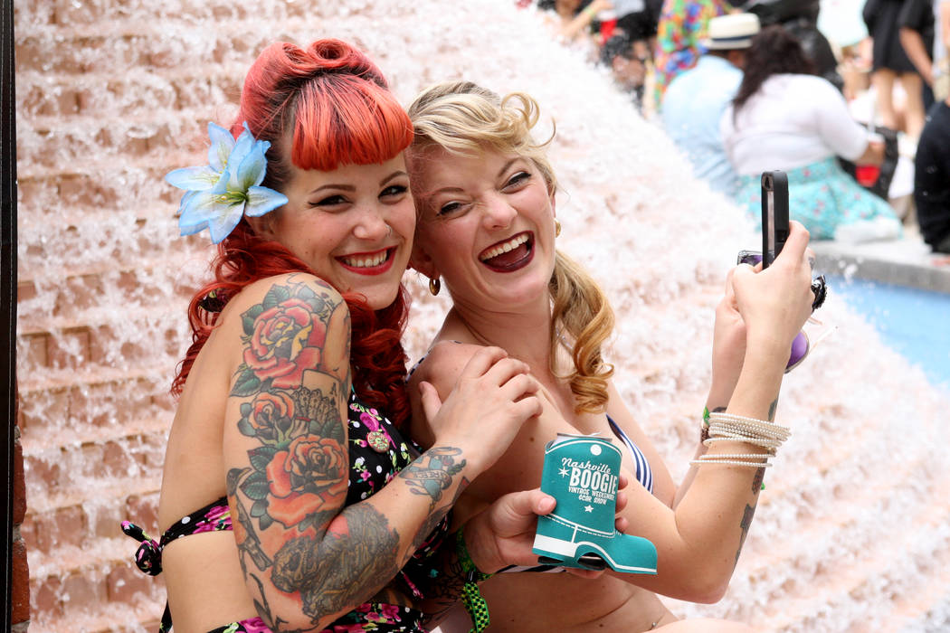 Autumn Tselios and Sage Quayle, both from Seattle, Wa., enjoy the final hours of the Viva Las Vegas Rockabilly Weekend Pool Party at the Orleans hotel-casino on Sunday, April 5, 2015. (Michael Qui ...